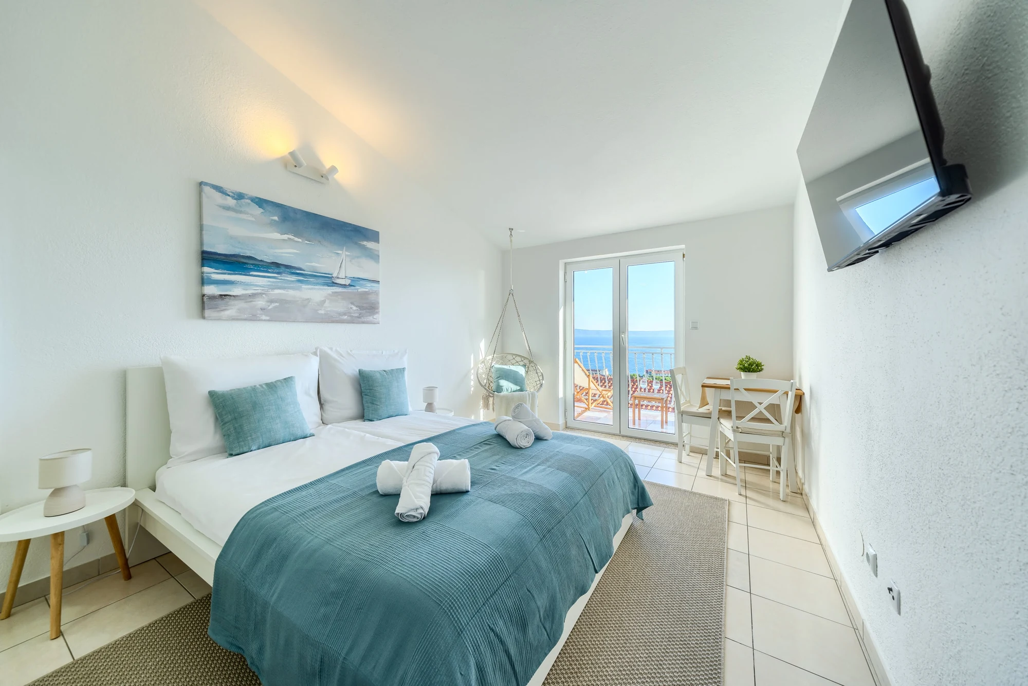 Sea View Studio Two with a double bed and sunny balcony doors
